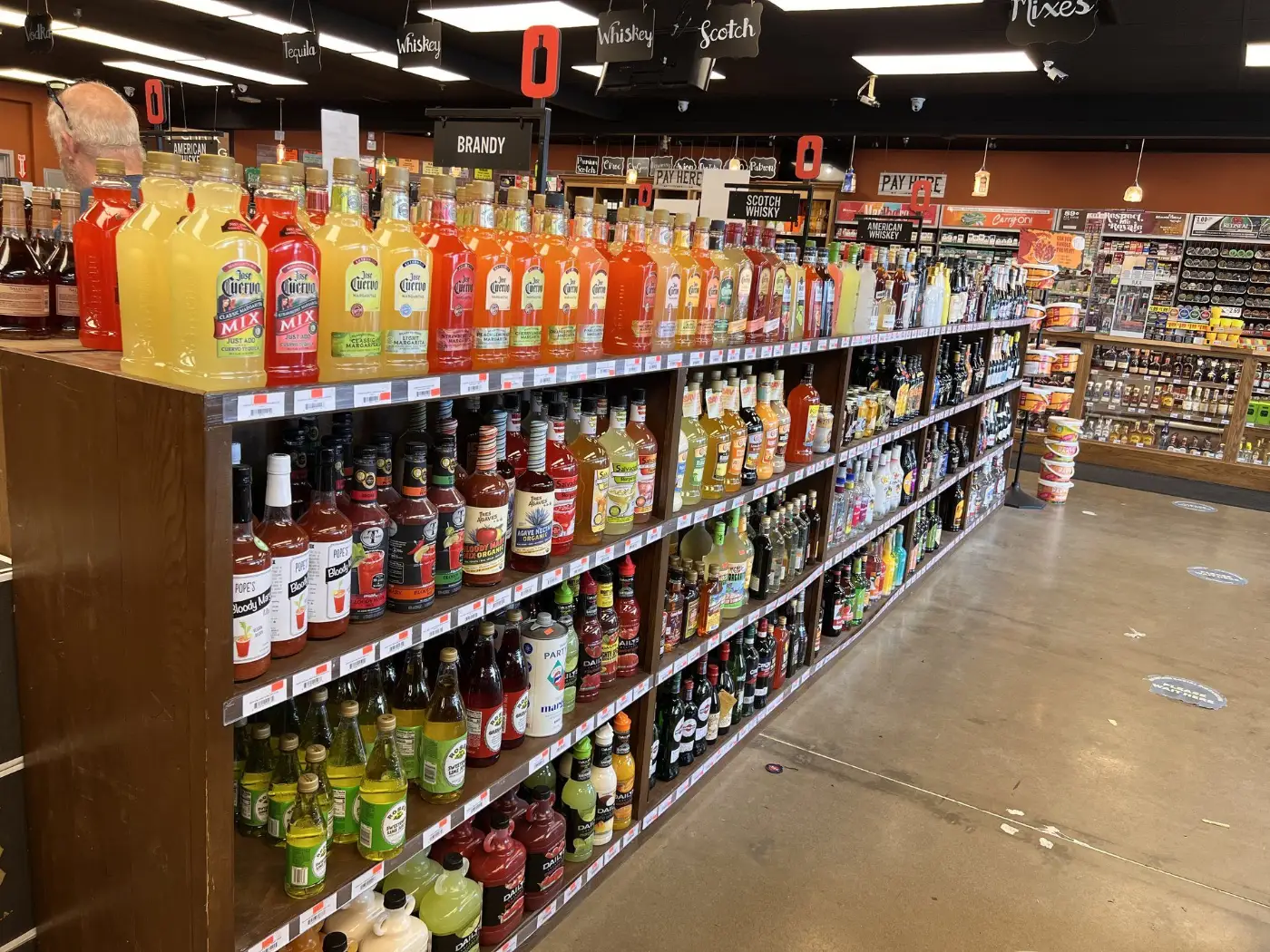 Cocktail mixes and brandy wall at GS Spirits Beer & Tobacco in Eastlake Ohio